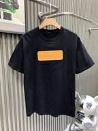 Louis Vuitton black short-sleeve T-shirt with gold rectangular logo patch