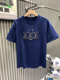 Blue T-shirt with large crown graphic on front, crew neckline.
