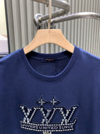 Blue T-shirt close-up of crew neck and front crown graphic detail.