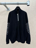 Black zip-front jacket with high collar and logo-print sleeve panels