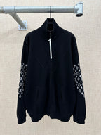 Black zip-front jacket with high collar and logo-print sleeve panels
