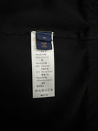 Black jacket care and material label with size tag