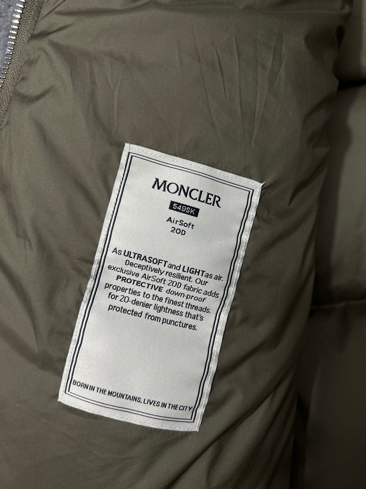 Moncler long puffer jacket fabric care label