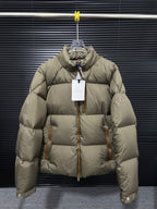 Moncler long puffer jacket in olive with front zip and high collar