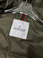 Olive puffer jacket with MONCLER logo tag on inside panel