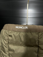 Olive puffer jacket back yoke with MONCLER label