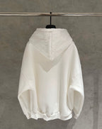 White zip-up hoodie with hood and large textured back logo