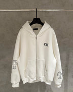 White zip-up hoodie with hood, front zipper pocket, and small chest logo