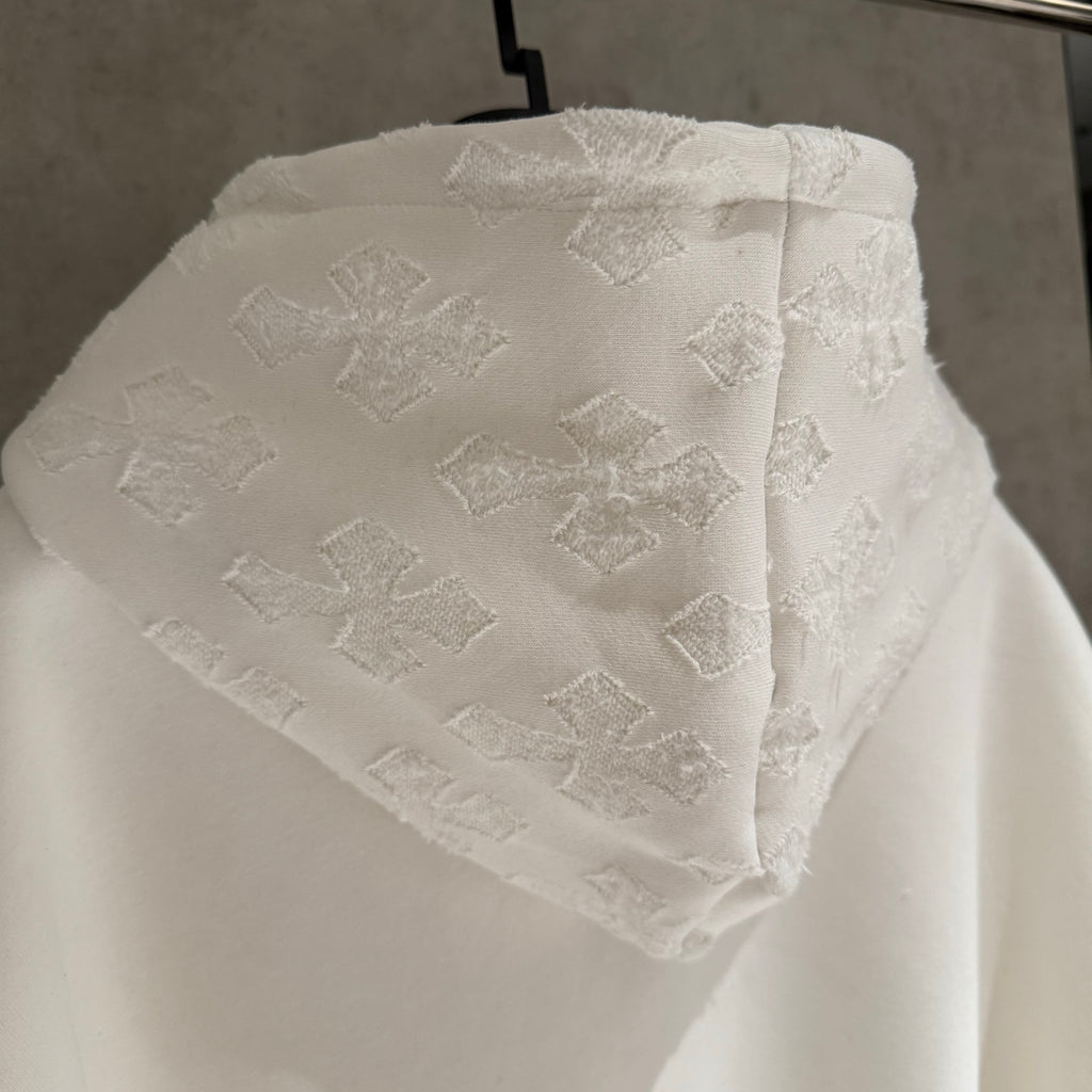 White textured hood with allover patchwork-style pattern