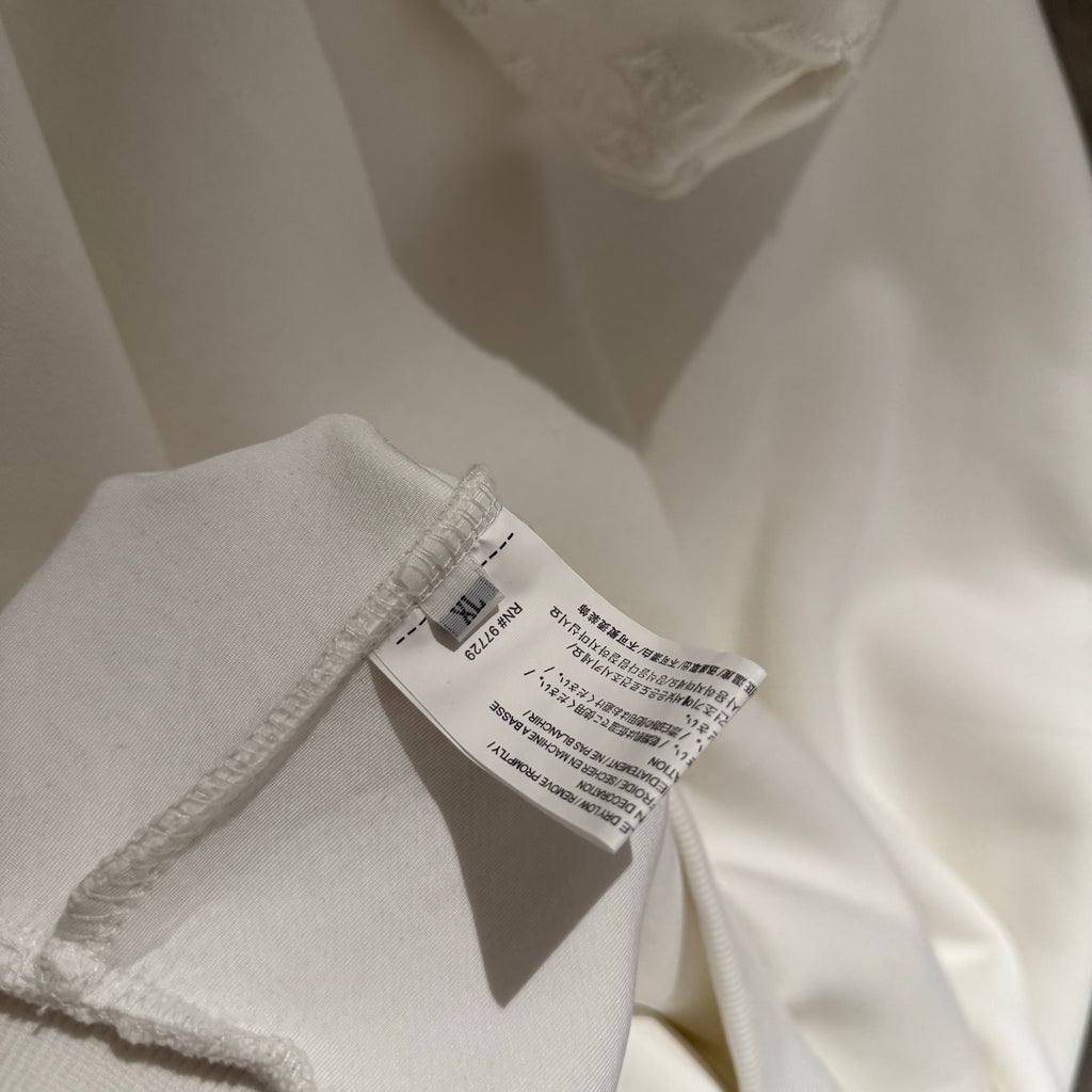 White hoodie fabric with inner neck care label and stitching