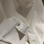 White hoodie fabric with inner neck care label and stitching