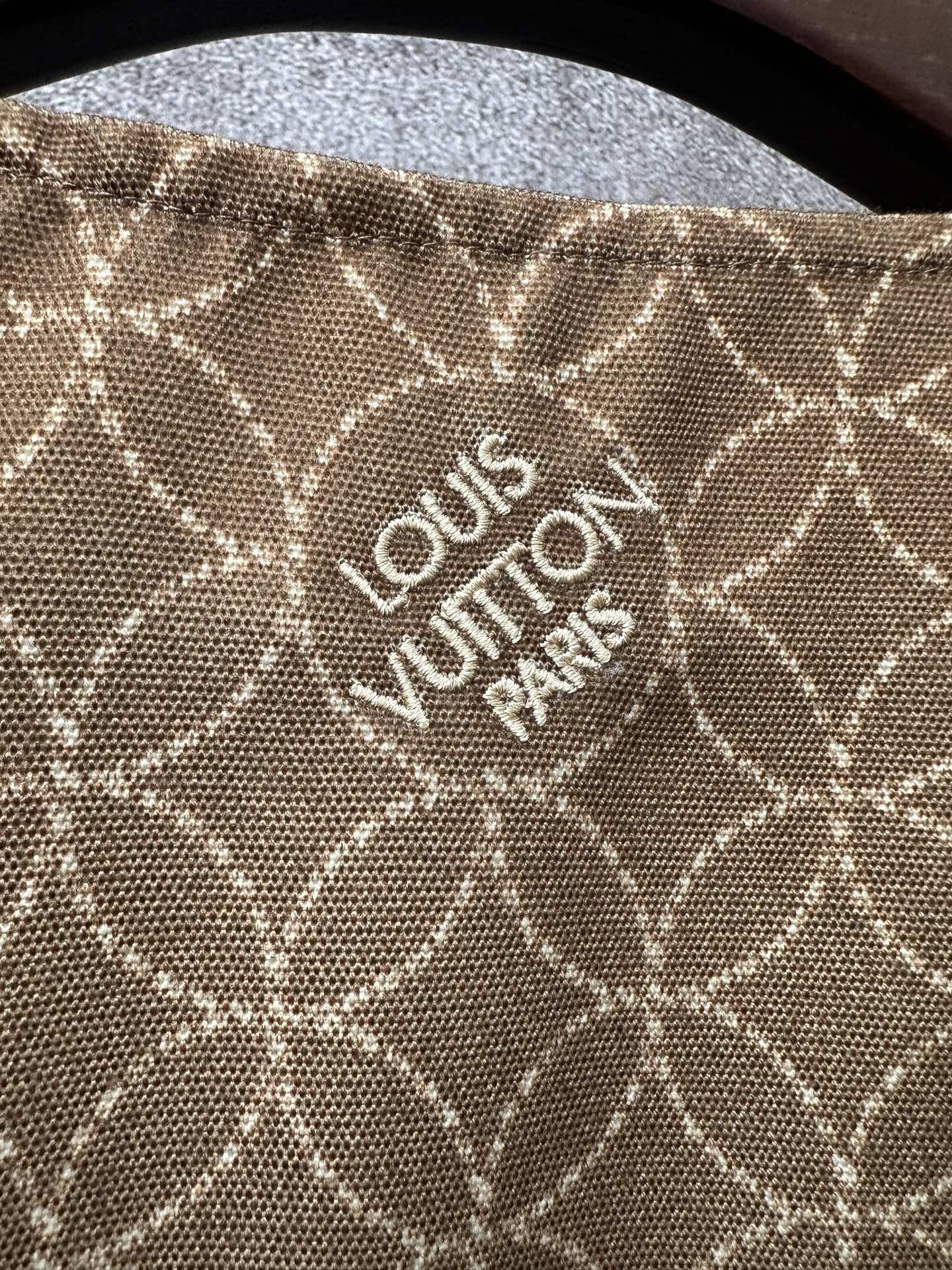 Long Louis Vuitton coat fabric with monogram pattern