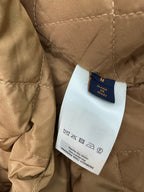 Long coat interior label with size M and care text