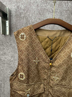 Gold monogram sleeveless vest with zip front and round embellished pocket flaps