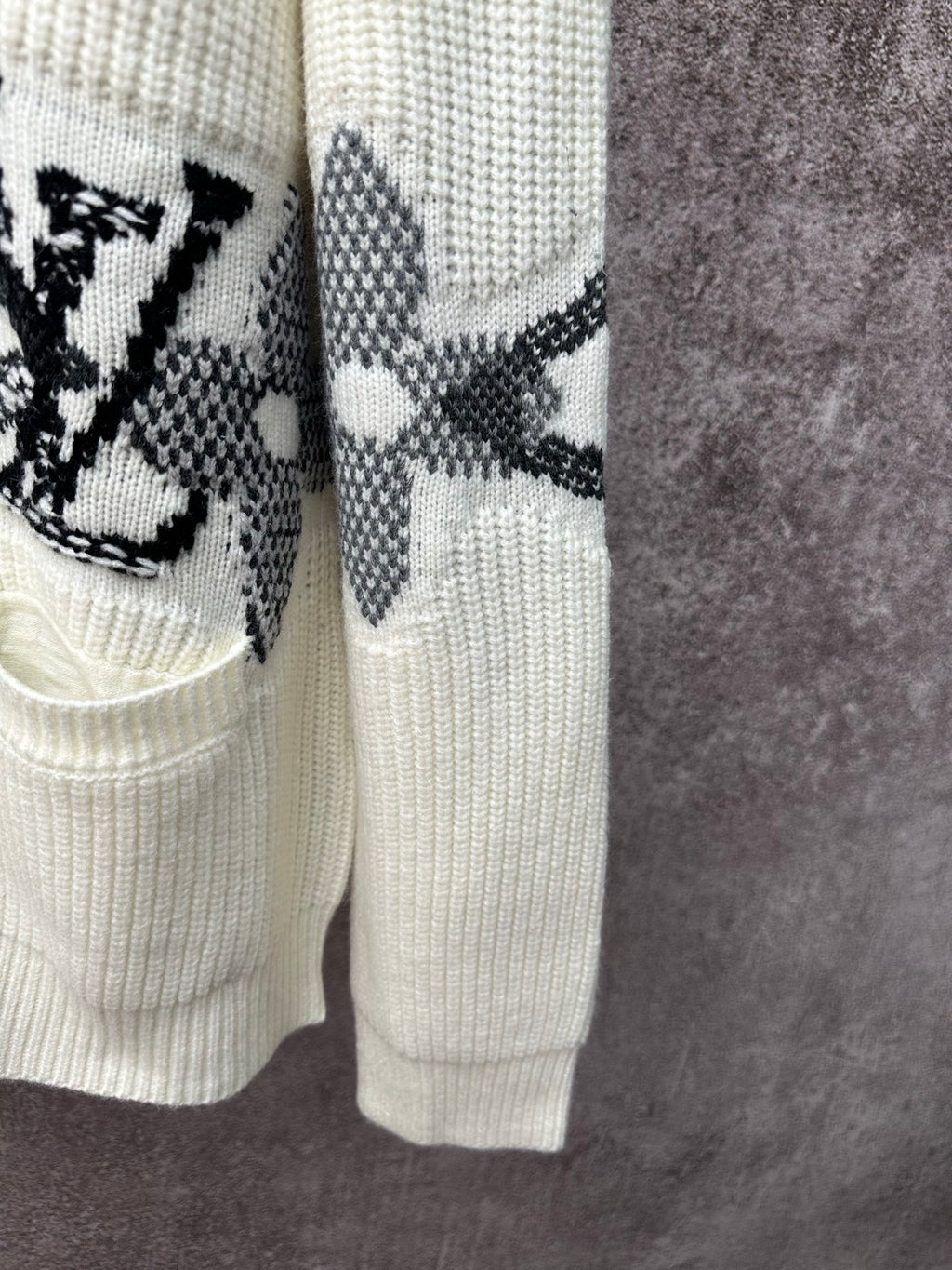 Cream cardigan hem and sleeve with black butterfly-style motif stripe embroidery