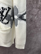 Cream cardigan hem and sleeve with black butterfly-style motif stripe embroidery