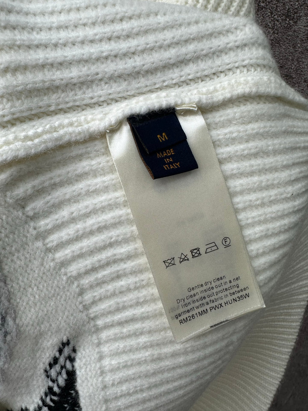 Louis Vuitton knit sweater neckline and care label tag, ribbed light knit