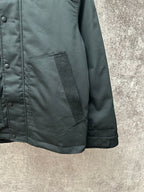 Dark jacket with side pocket and buttoned front placket detail