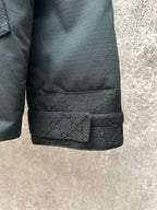 Dark jacket hem with elastic trim and monogram band detail