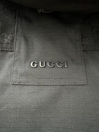 Gucci interior neck label on dark jacket lining