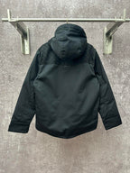 Back view of dark hooded jacket with hood and buttoned center placket