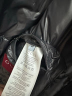 Gucci size 48 care label on dark gray puffer jacket lining