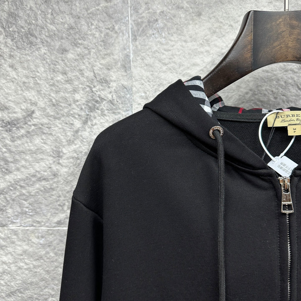 Burberry zip-up hoodie, black, close-up of hood with plaid-lined interior and zipper