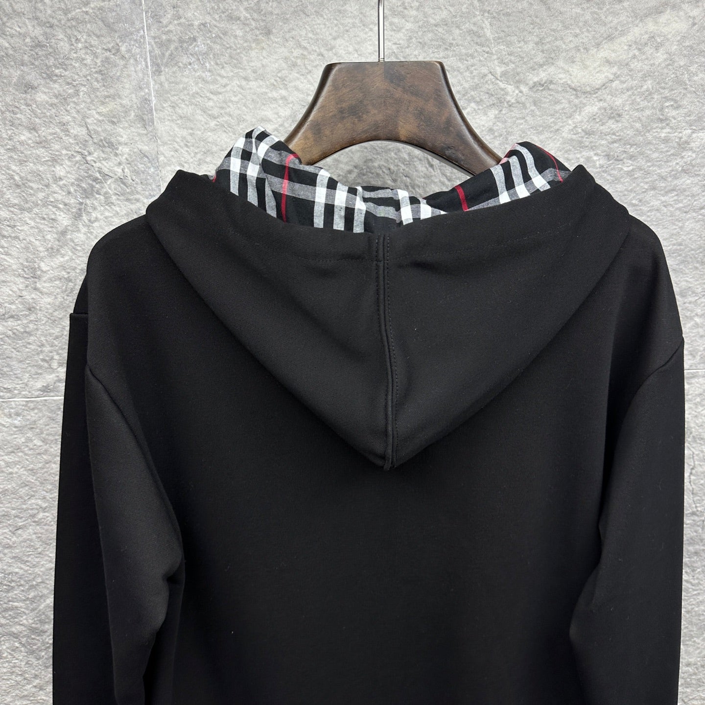 Burberry zip-up hoodie, black, back view with hood and plaid-lined trim