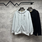 Burberry zip-up hoodies, light gray and black, both with front zippers and hoods