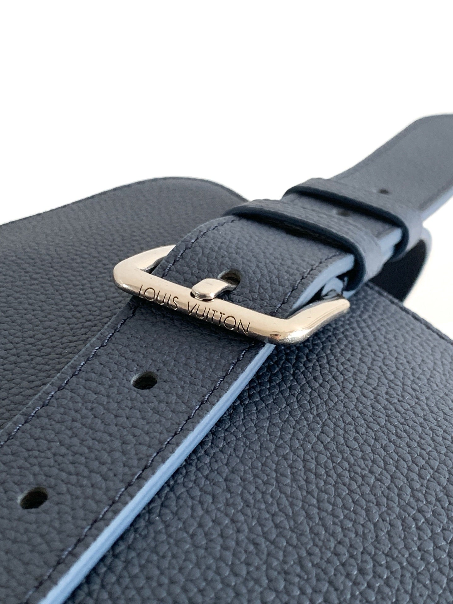 Men's Louis Vuitton blue leather strap with silver buckle and punched holes