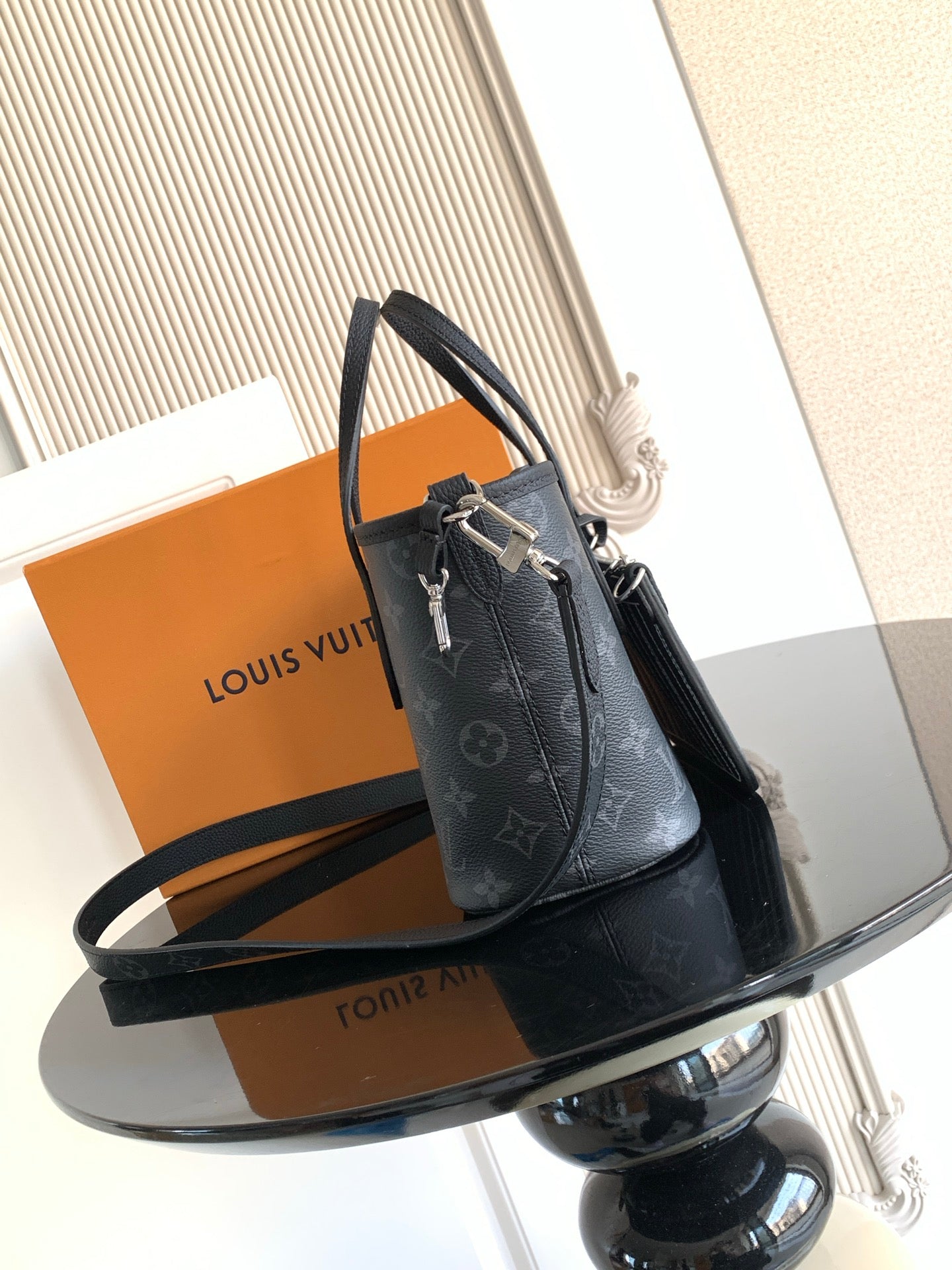 Men's Louis Vuitton dark blue mini bag with top handles and shoulder strap