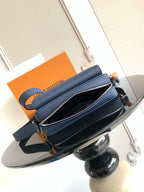 Blue crossbody bag with double zip compartments and adjustable shoulder strap
