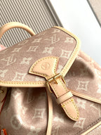Louis Vuitton monogram mini bag flap with beige leather strap and gold-tone buckle hardware.