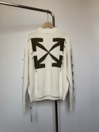Off-white knit sweater with large black geometric star motif on the back