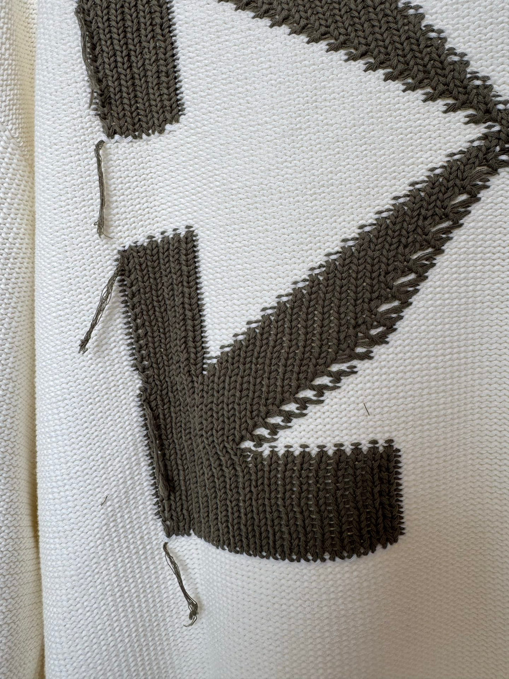 Off-white sweater knit with black diagonal stripe and block motif detail