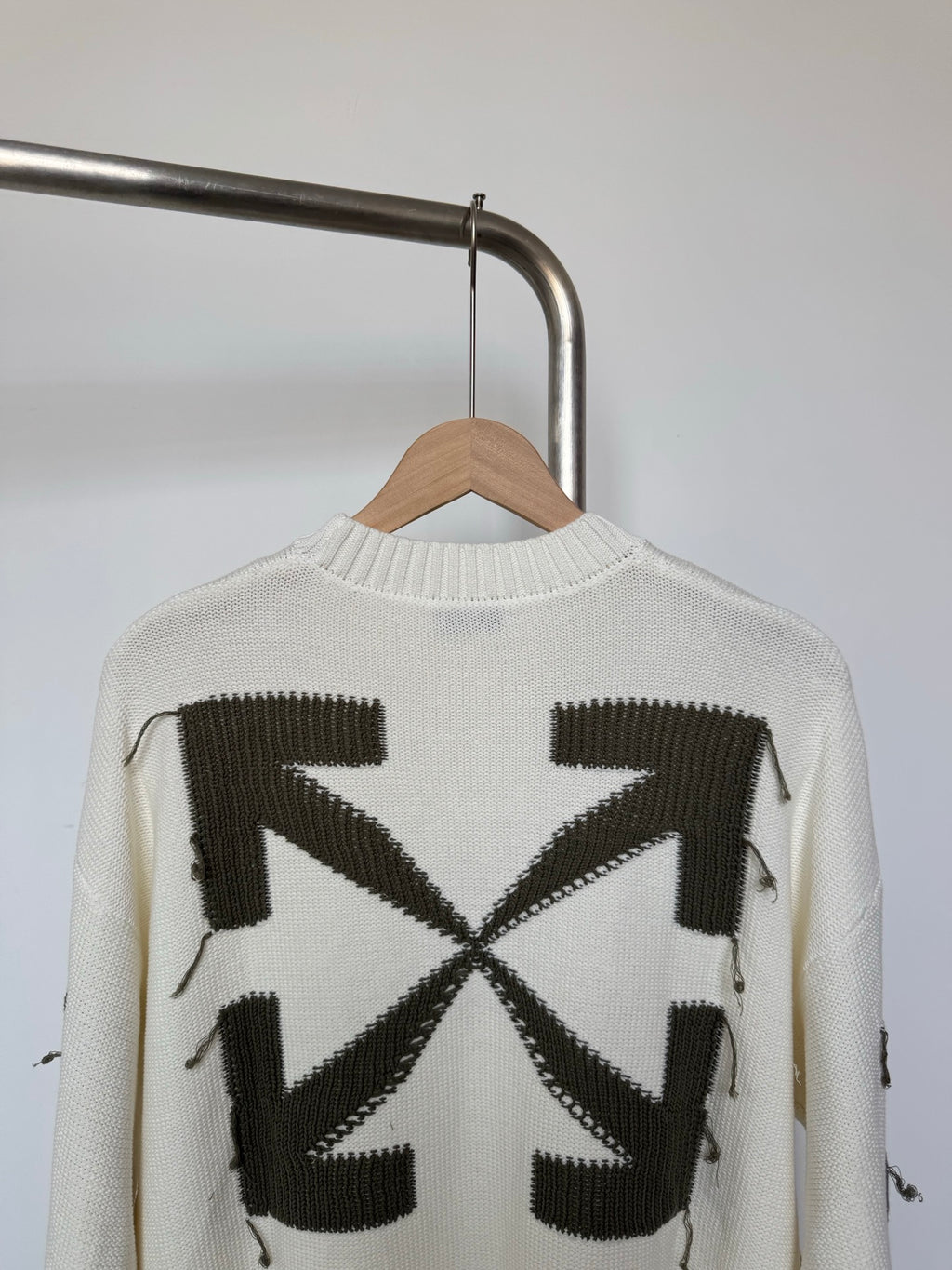 Off-white knit sweater back with black geometric square and X motif
