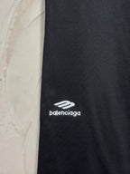 Balenciaga dark black pants with white logo print on side of leg
