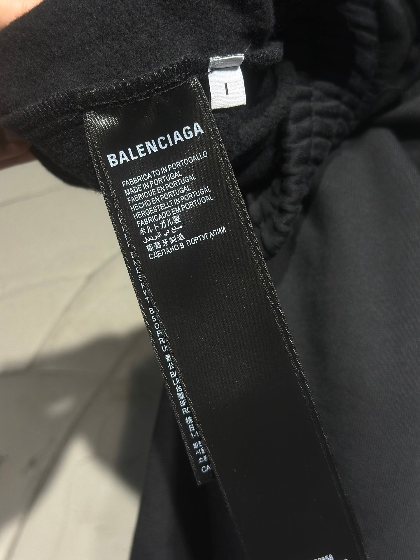 Balenciaga pants care label on inner waistband with fabric composition text