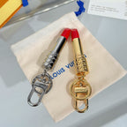 Small bag charm set with silver and gold lipstick pendants, red lip tops, metal keyrings