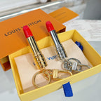 Small bag charm set with two lipstick pendants—gold and silver—plus metal keyring clasps