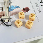 Louis Vuitton keychain hardware parts with monogrammed dice charms