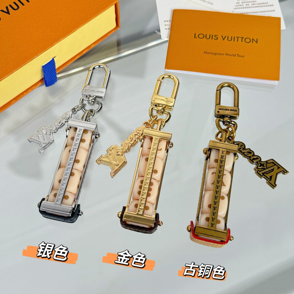 Set of Louis Vuitton mini bag charm keychains with gold and silver hardware