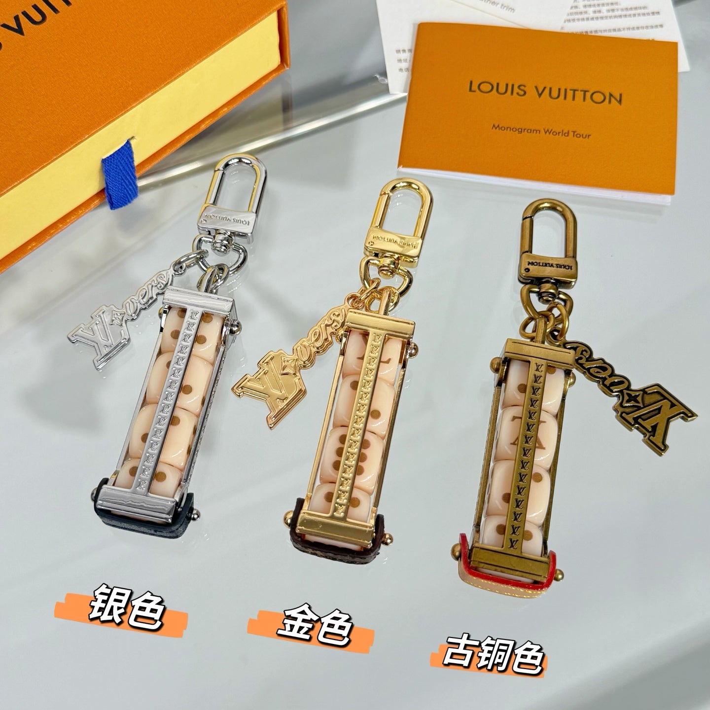 Set of Louis Vuitton mini bag charm keychains with gold and silver hardware
