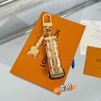 Louis Vuitton mini bag charm keychain with gold padlock clasp and chain