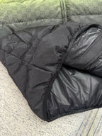 Dark gray puffer jacket with allover GG logo texture and padded quilting