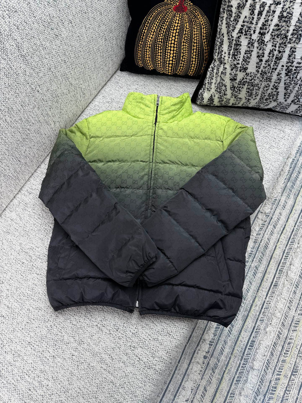 Long padded puffer jacket, black with quilted panels and front zipper