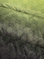 Two-tone puffer jacket panel with lime green and dark GG logo pattern