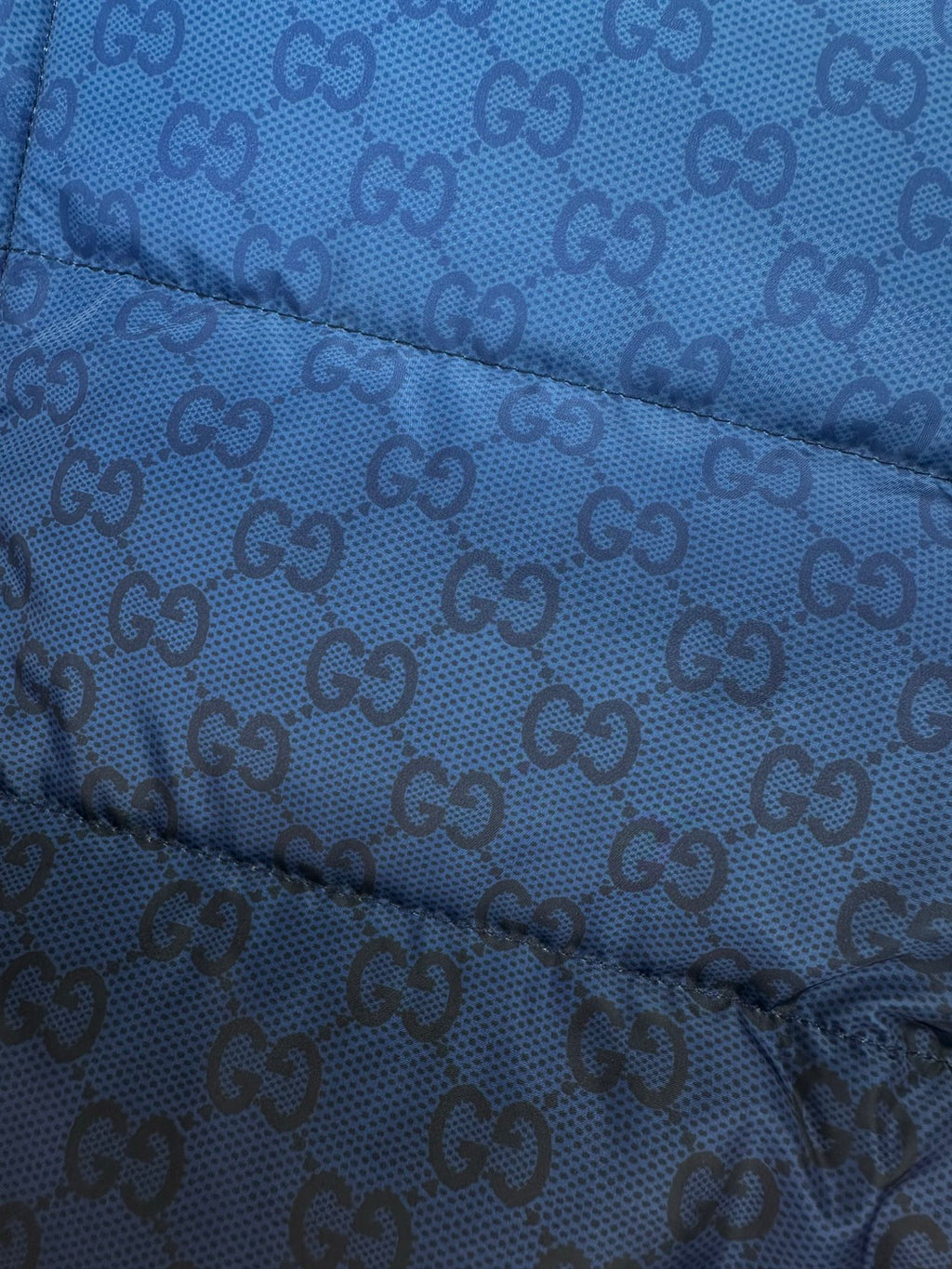 Gucci blue GG-pattern quilted puffer jacket fabric with stitched baffles
