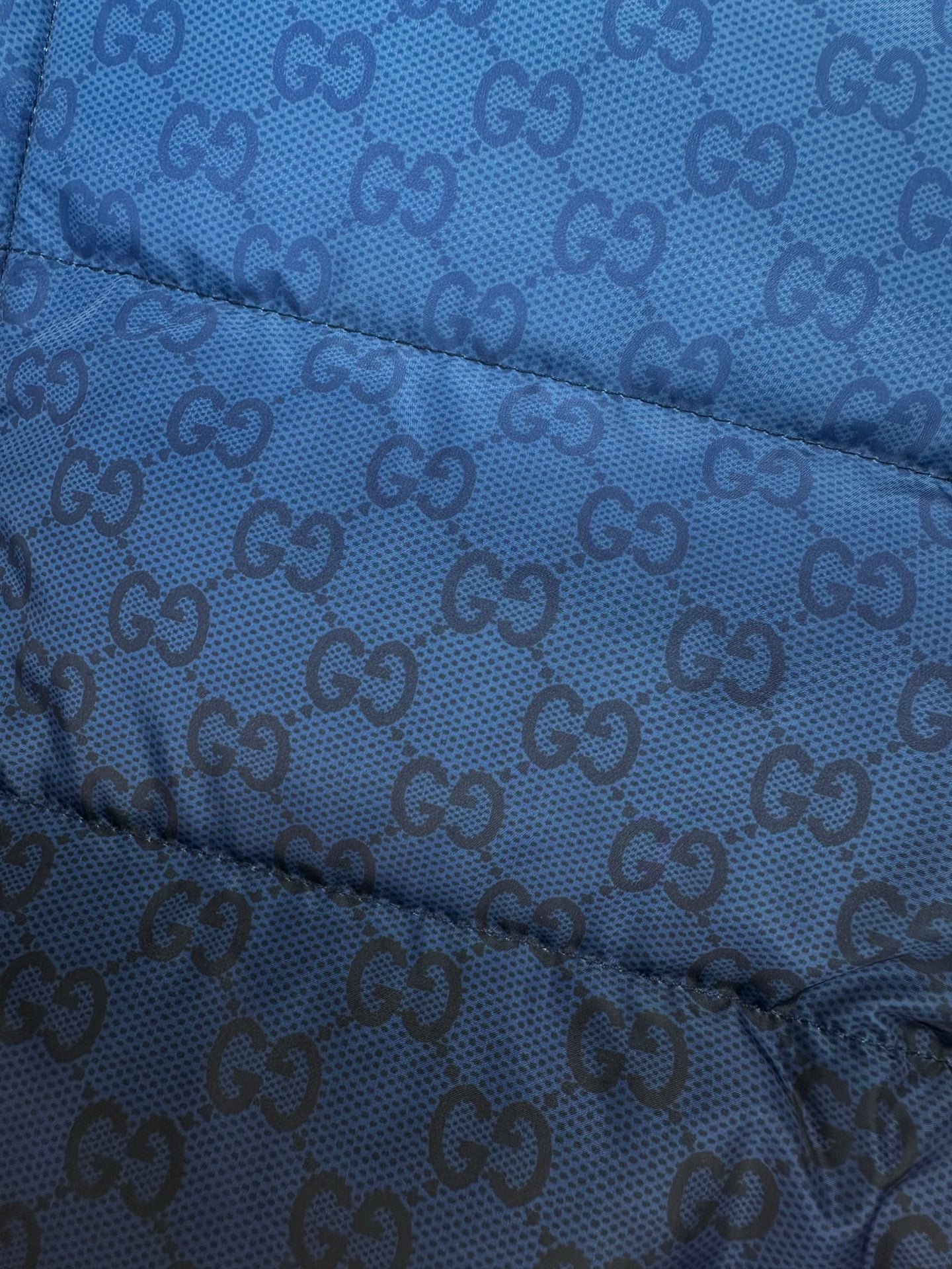 Gucci blue GG-pattern quilted puffer jacket fabric with stitched baffles