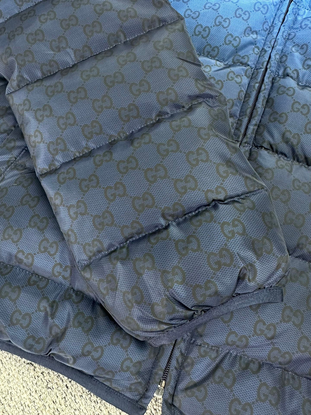 Gucci light-blue GG-pattern puffer jacket, diagonal quilted panel